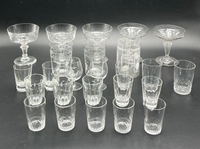 a lot of glasses that are sitting on a table