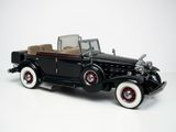a model of a black car on a white surface