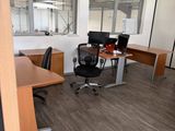 an image of an empty office with a lot of desks