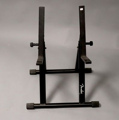a black stand with a sign on it on a white background