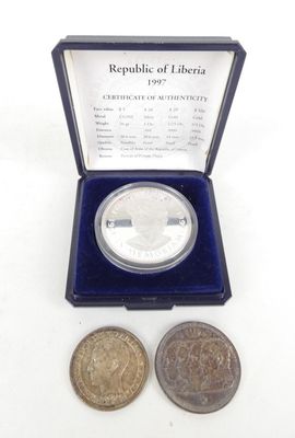 an image of a silver coin and a silver coin in a blue box
