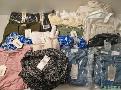 many different types of clothes on display in a box