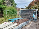 a fence that has been placed next to a gate