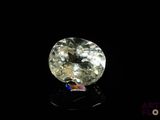 a close up of a diamond on a black surface