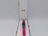 a close up of a pink lipstick in a box on a white surface