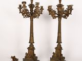 pair of antique bronze candelabs on pedestals with figurines