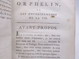 an open book on a white table with a black and white image