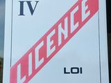 a sign on the window of a building that says licence