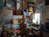 a room filled with lots of boxes and boxes on the floor