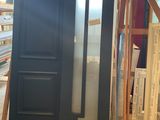 an image of a large black door in a warehouse