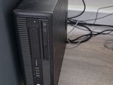 a desktop computer sitting on the floor next to a wall