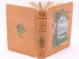 an old book with a picture of a tree on it