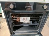 a sign on the door of an oven that is not in the oven