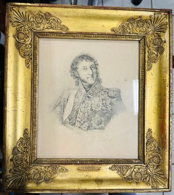 cadre doré orné d'un dessin représentant un homme en costume-cravate