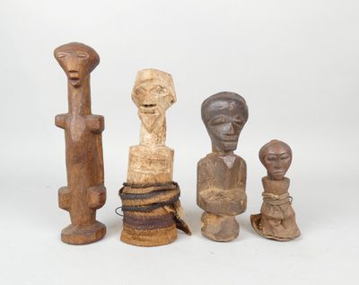 three wooden sculptures of different shapes and sizes on a white surface