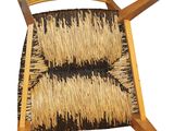 an image of a wooden chair with a woven seat and back