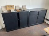 an image of a room with a desk and a cabinet