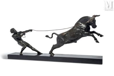 statue of a man pulling a bull with a rope