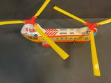 a toy helicopter that is sitting on a table