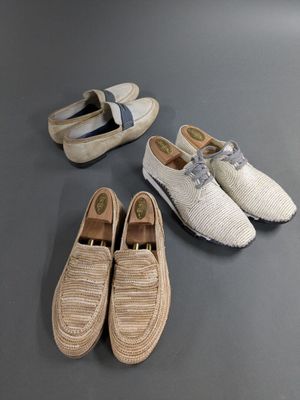 three pairs of shoes and a pair of shoes on a table