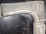 an old fireplace with a stone mantle in the corner