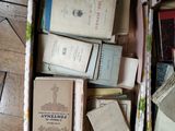 a box full of books on a wooden floor