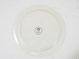 a white plate with a blue and white design on it