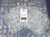 a lot of coins in a bag on a table