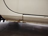 a close up of a car ' s tire on the ground