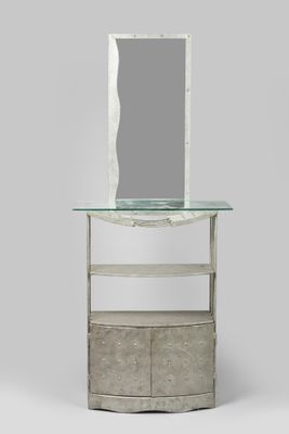 an image of a mirror sitting on top of a table next to a shelf