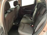 the back seats of a car with a cup holder in the back