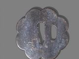 a small metal object with a hole in the middle of it
