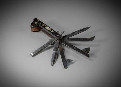 a knife that is laying on top of a knife holder