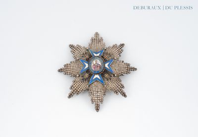 a picture of a brooch with a blue star on it