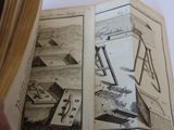 an open book with a picture of a building inside of it