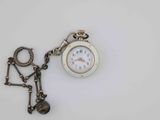 a small pocket watch with a chain attached to it