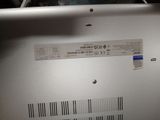 a close up of a laptop with a barcode on it