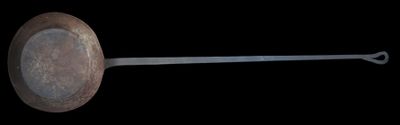 an image of a wooden spoon with a metal handle on a black background