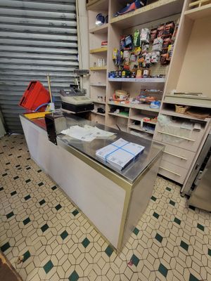 a counter in a store that has a lot of items on it