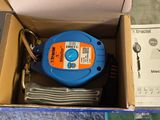 a box that has a blue and orange hose in it