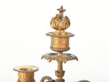 three candles that are sitting on top of a table