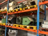 many different types of electronics on the shelves in the warehouse