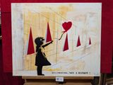 un tableau représentant une petite fille tenant un ballon en forme de cœur
