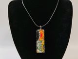 a close up of a necklace on a mannequin neck