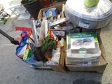 a box full of items sitting on the sidewalk