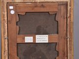 an old wooden frame with a picture of a person in it