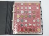 a binder with a lot of coins inside of it