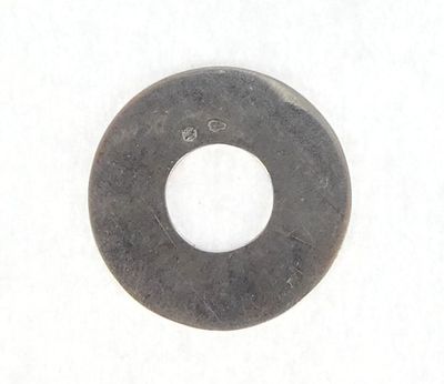 a close up of a metal washer on a white surface
