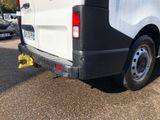 a white van that is parked on the side of the road
