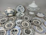 many different types of blue and white plates on the table